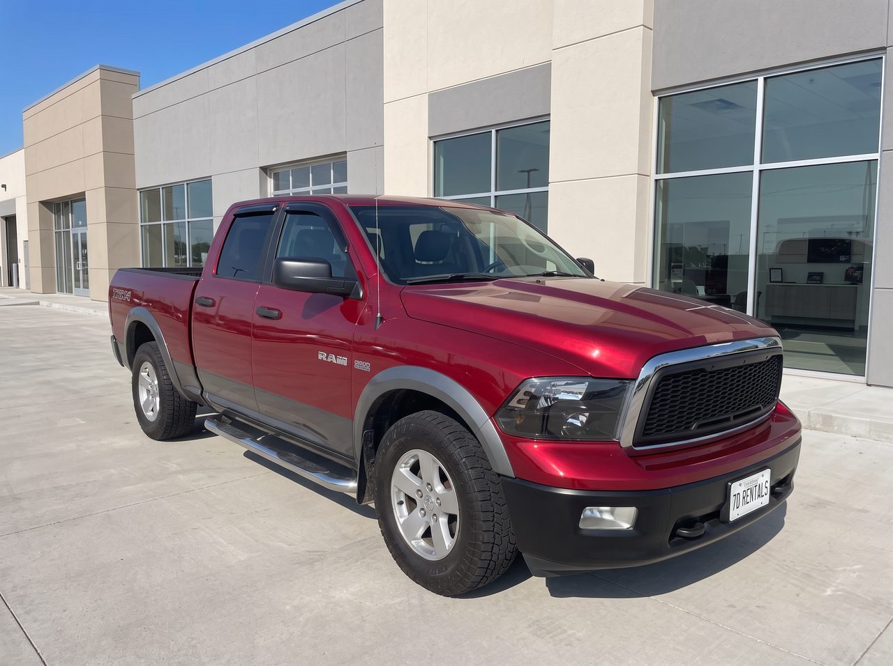 Red 2010 Dodge Ram 1500 TRX4 daily truck rental from 7D Rentals
